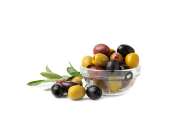 Green, black and red olives isolated on white background. Various types of olives and with fresh olive leaves. Mediterranean food. Vegan.