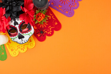 Celebrate Dia de los Muertos. Top view arrangement of traditional mask with elaborate decorations,...