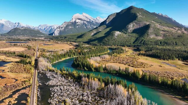 Drone view of a forest, rivers and mountains in the Rocky Mountains. Landscape from the air. Video for background. Fall view. Mountains and forest. Banff National Park, Alberta, Canada