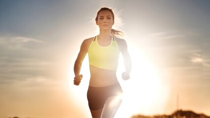woman runs in backlit sunlight