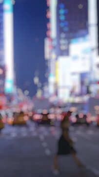 New York at night, stylish women crossing a street, vertical short video
