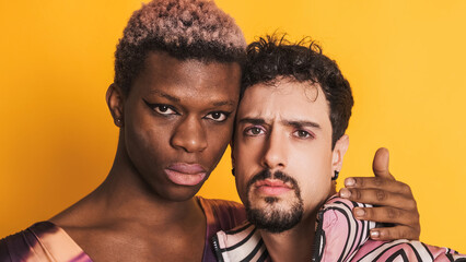 Multiethnic transgender and gay men looking at the camera with a serious look - obrazy, fototapety, plakaty