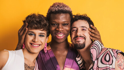 Multiracial transgender men smiling at the camera together - obrazy, fototapety, plakaty