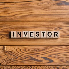 Word investor appearing to be man-made with wooden blocks