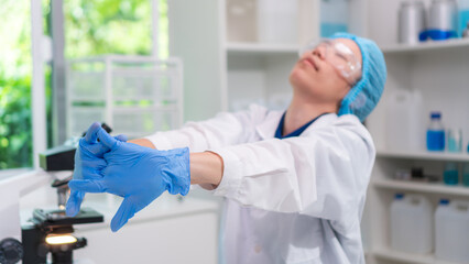 Scientist working laboratory neck pain stretching and office syndrome tired