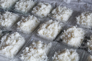 White rice on plastic container, to be distributed
