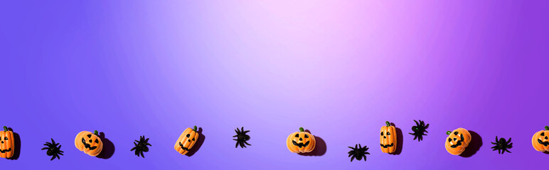 Miniature Halloween pumpkin ghosts with spiders - flat lay