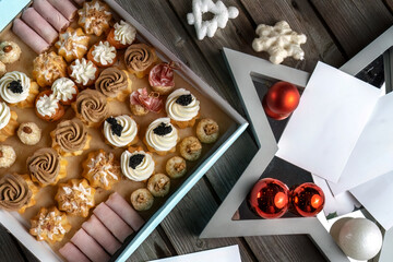 Festive savory profiteroles with caviar, cream cheese and dill in a large box for delivery....