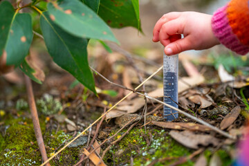 toddler with test tube learning science