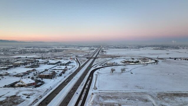 Dusk aerial video I-25 between Denver and Fort Collins, Colorado winter snow