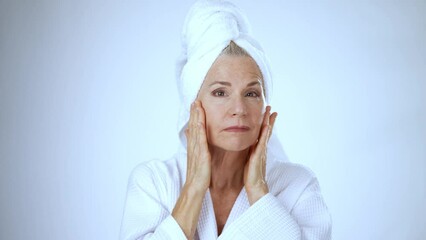 Portrait beautiful mature old woman in robe and towel on head smiling, wonder about face lift cosmetic plastic surgery healthy skin natural makeup skincare anti aging lifting wrinkles beauty self love