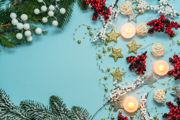 Top view on new year pattern on light blue background with colorful decoration ornaments things. Concept of winter, christmas or new year. Flat lay