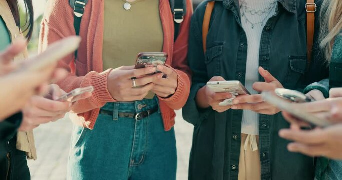 Hands, phone and circle with friends, campus and mobile connection with scroll, typing and click in summer. Girl students, smartphone and huddle for social network app at high school in Los Angeles