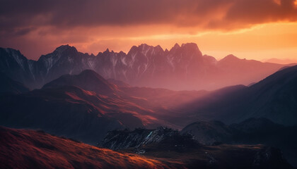 Majestic mountain range silhouetted against tranquil sunset, a nature adventure generated by AI