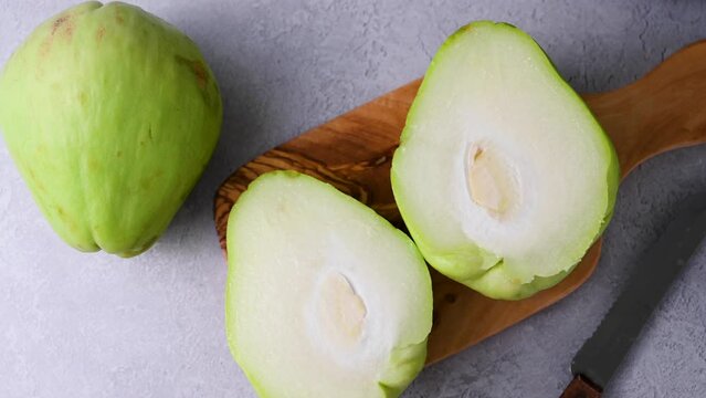 Chayote exotic fruits on grey background. 