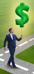 Businessman walking with inflatable dollar sign