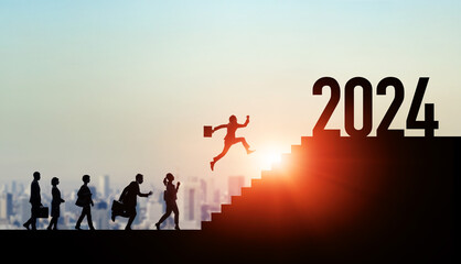 Group of multinational people running up the stairs from 2023 to 2024. 2024 New Year concept. New...