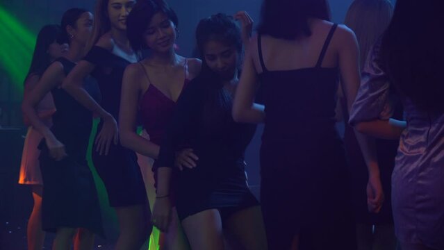 group of diversity happy sexy young people enjoy dancing in night club .Two sensual women  lesbian
