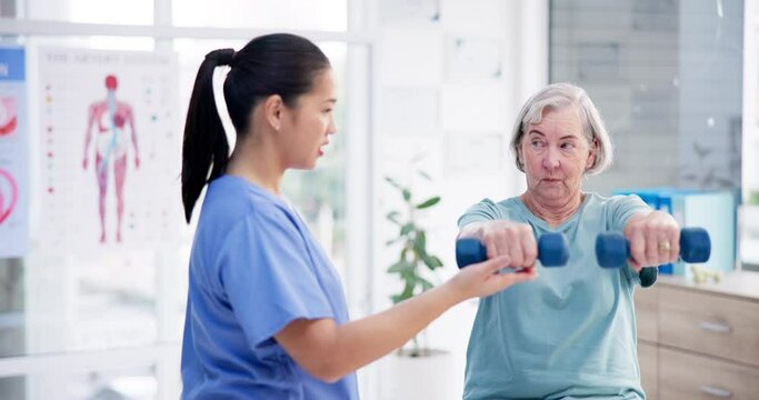 Dumbbells, physiotherapist or senior woman in fitness workout, exercise or stretching arms in retirement. Nurse, physiotherapy or happy elderly person training for body health, wellness or mobility