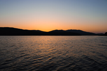 Beautiful evening sky. Sunset in the city by the sea.
