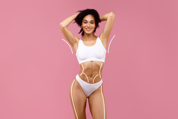 Sensual attractive young black woman posing in white underwear