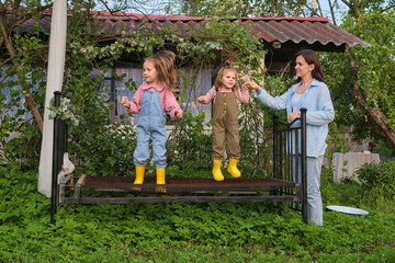 greenery takes over the man-made structure, two girls find harmony in their playful endeavors. Nature and Nurture: Finding Balance in Childhood Development.