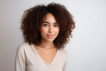 Beautiful young smiling afroamerican woman with curly hair portrait
