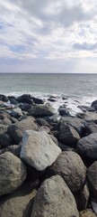 Fototapeta na wymiar large mountain stones on the seashore