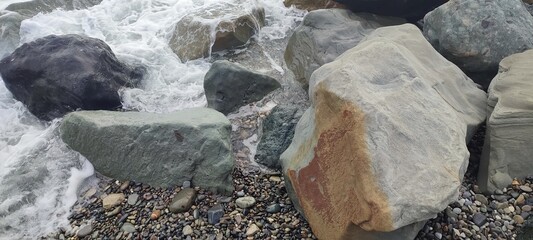 large mountain stones on the seashore