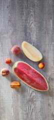 fruit set on the table made of a quarter of watermelon, melon, peaches