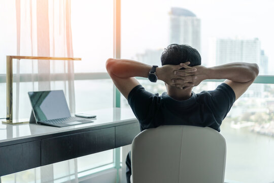 Life-work balance and living life style concept of businessman relaxing, take it easy in hotel or office room resting with thoughtful mind thinking of lifestyle quality looking forward to city