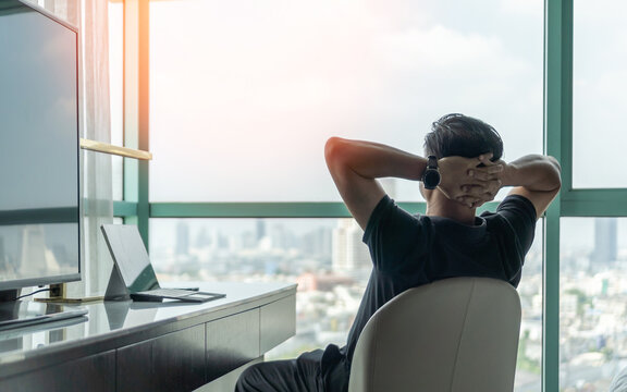 Life-work balance and living life style concept of businessman relaxing, take it easy in hotel or office room resting with thoughtful mind thinking of lifestyle quality looking forward to city