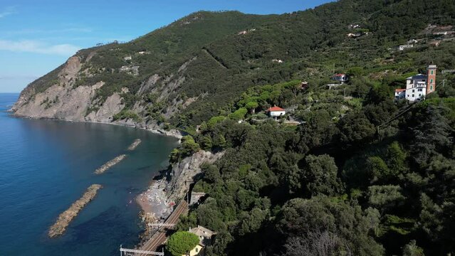 Europe, Italy, Framura is a little sea village in Liguria close to 5 terre ( five island )  - drone aerial view of mediterranean coast - natural harbour and beach 