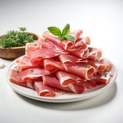 thinly sliced jamon with green leaves on a plate on the table. 