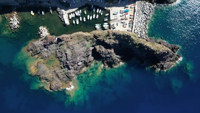 Europe, Italy, Framura is a little sea village in Liguria close to % terre ( five island )  - drone aerial view of mediterranean coast - amazing natural bay with beach and boats visiting 