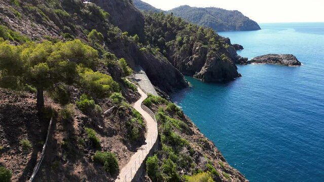 Europe, Italy, Framura is a little sea village in Liguria close to 5 terre ( five island )  - drone aerial view of mediterranean coast - hiking and trekking walking by over the sea 