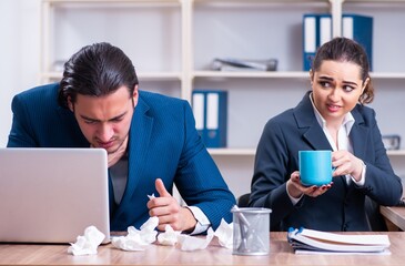 Two employees suffering at workplace