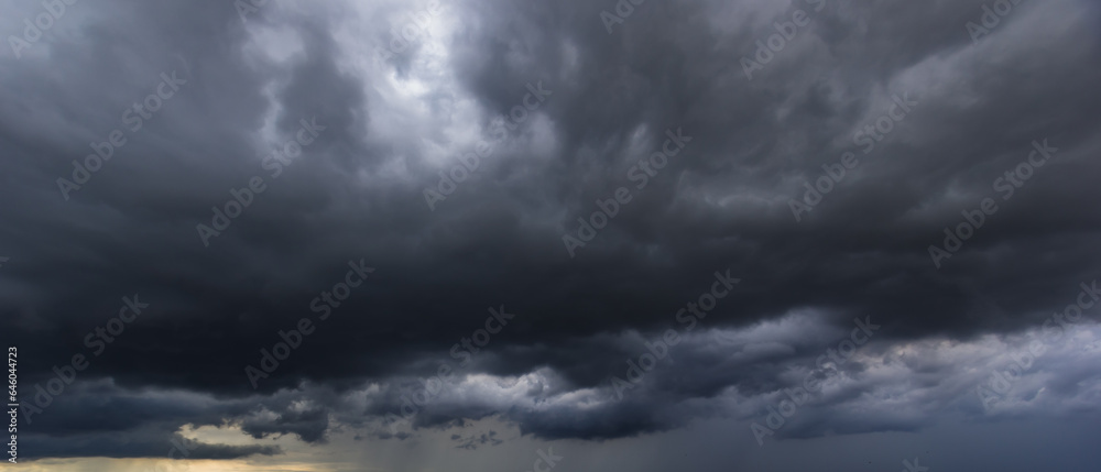 Poster the dark sky with heavy clouds converging and a violent storm before the rain.bad or moody weather s