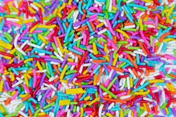 Fototapeta na wymiar Colorful sugar sprinkles , top view