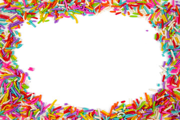 Fototapeta na wymiar Frame made of colorful sprinkles on white background, top view. Confectionery decoration