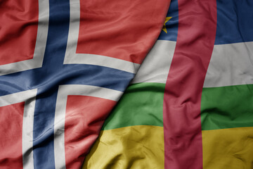 big waving national colorful flag of norway and national flag of central african republic .