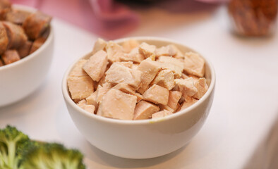 Potluck party with a delightful spread of meat, vegetables, and bread dishes, embodying community and culinary diversity
