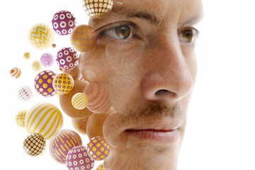 A double exposure male portrait combined with 3D spheres on white background