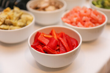 Potluck party with a delightful spread of meat, vegetables, and bread dishes, embodying community and culinary diversity