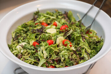 Potluck party with a delightful spread of meat, vegetables, and bread dishes, embodying community and culinary diversity