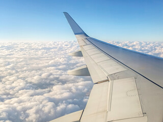 Aerial clouds and landscape view out of a plane