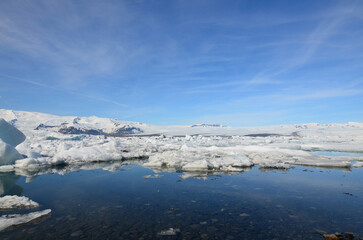 Fototapeta na wymiar Blue Skies Over an Icey Landscape in Iceland