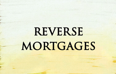 Reverse mortgages concept written on abstract background 