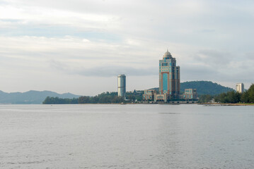 A view of Kinabalu Tower, also known as Sabah State Administrative Center, from an embankment of Kota Kinabalu, Sabah, Malaysia