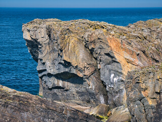 Exposed rock strata in coastal cliffs on the rocky, rugged, Atlantic coast of the Isle of Lewis in...